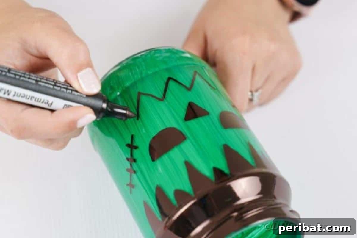 Charming Frankenstein Mason Jar Halloween Glow 11 Drawing smile on mason jar