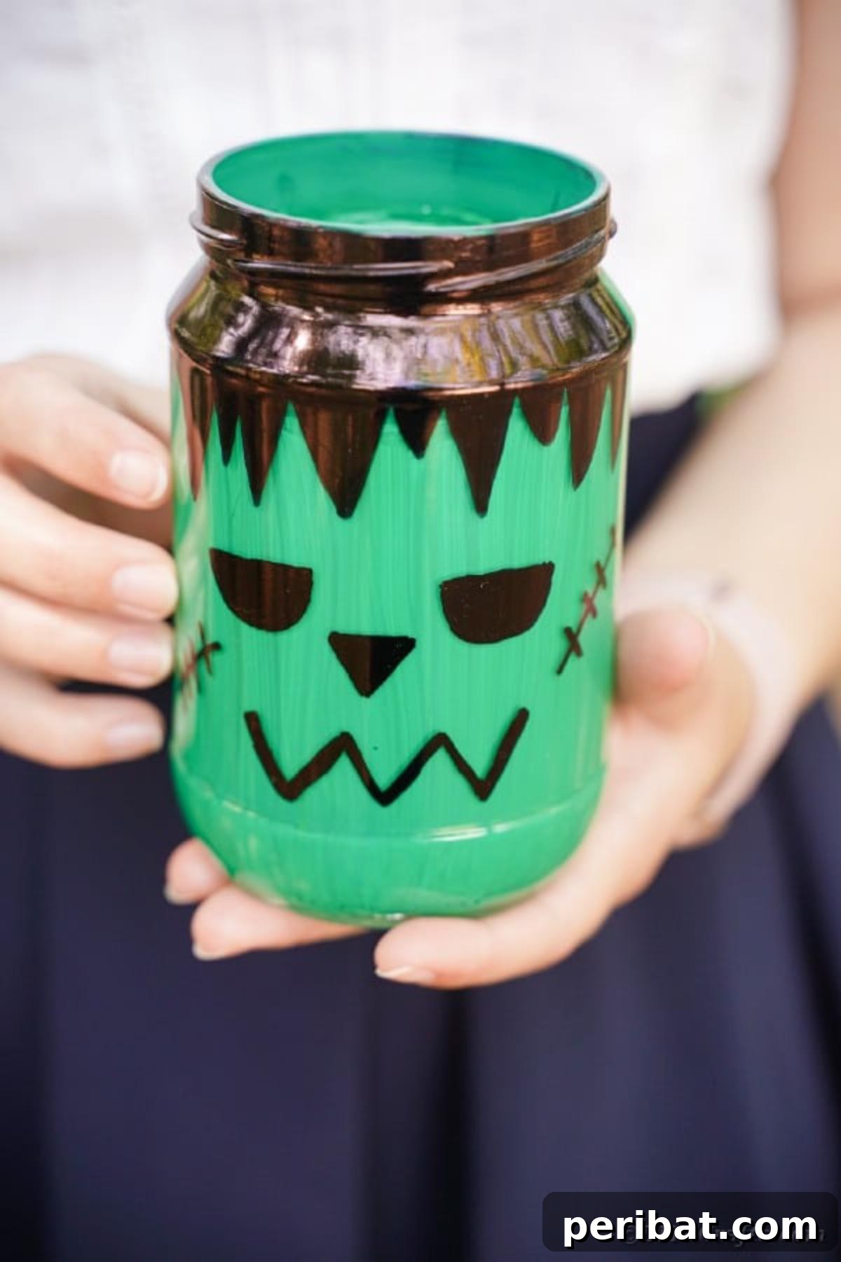 Charming Frankenstein Mason Jar Halloween Glow 13 Woman holding a mason jar frankenstein