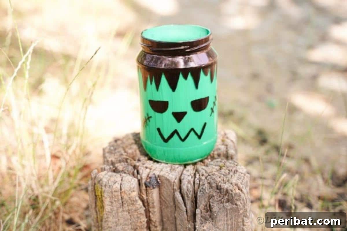 Charming Frankenstein Mason Jar Halloween Glow 5 Mason jar frankenstien on stump