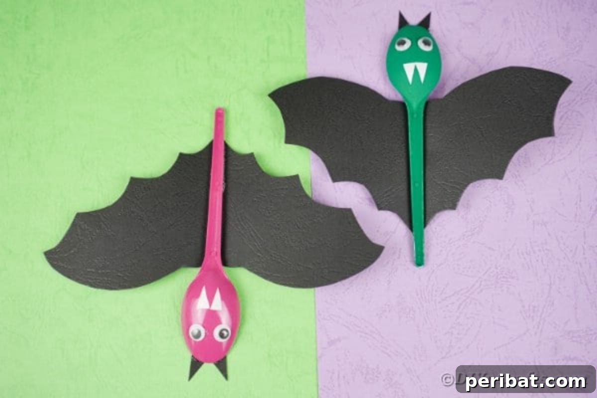 Adorable Recycled Plastic Spoon Bat Halloween Decor 7 A creative Halloween display featuring multiple upcycled spoon bats suspended against vibrant green and purple backgrounds, illustrating various hanging positions and cheerful expressions.