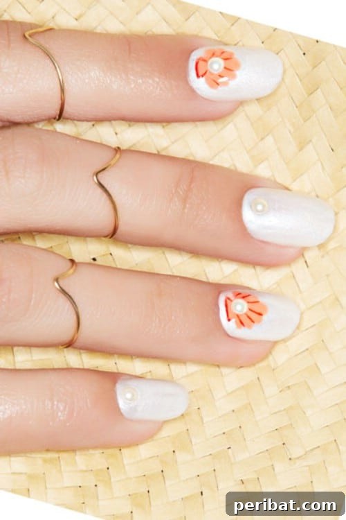 Adorable Sea Shell Nail Art with Pearl Accents