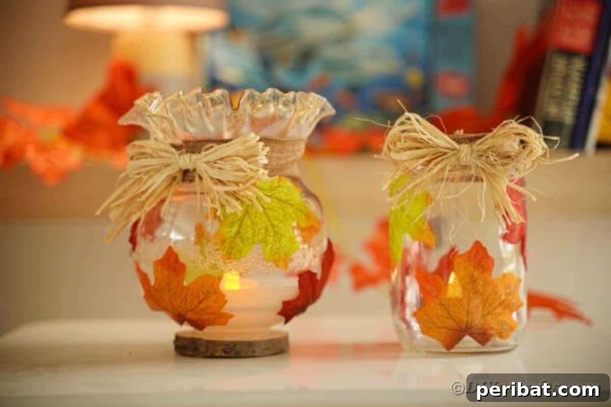 Autumn Leaf Jar Luminaries 4 A close-up of a glass jar lantern adorned with vibrant artificial fall leaves, showcasing the delicate details and the rustic charm it adds to a tabletop setting.