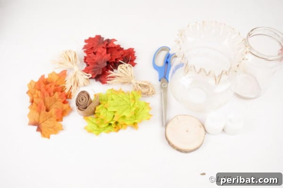 Autumn Leaf Jar Luminaries 8 A flat lay showing all the essential supplies for making fall leaf lanterns, including jars, artificial leaves, ribbons, and glue, laid out neatly on a surface.