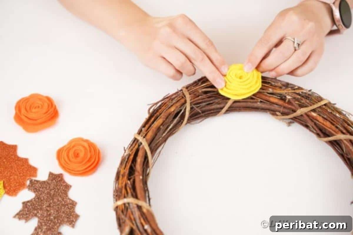 Autumn Grapevine Wreath with Soft Fabric Blooms 16 Gluing Flower onto grapevine wreath
