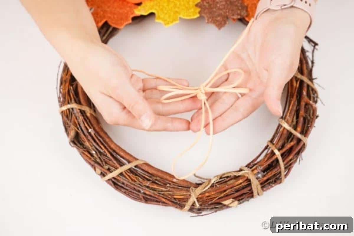 Autumn Grapevine Wreath with Soft Fabric Blooms 19 Making bow out of ribbon