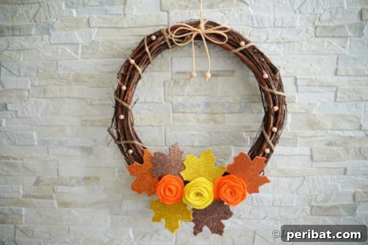 Autumn Grapevine Wreath with Soft Fabric Blooms 3 Grapevine wreath against brick wall
