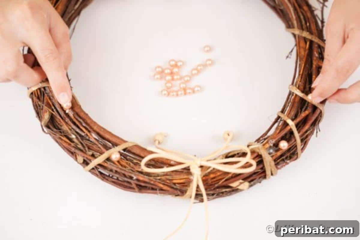 Autumn Grapevine Wreath with Soft Fabric Blooms 22 Gluing beads onto grapevine wreath