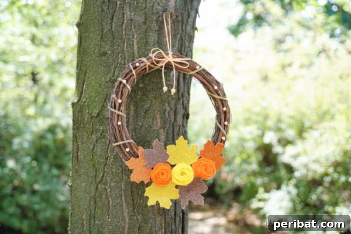 Autumn Grapevine Wreath with Soft Fabric Blooms 4 Fall wreath with flowers hanging in tree