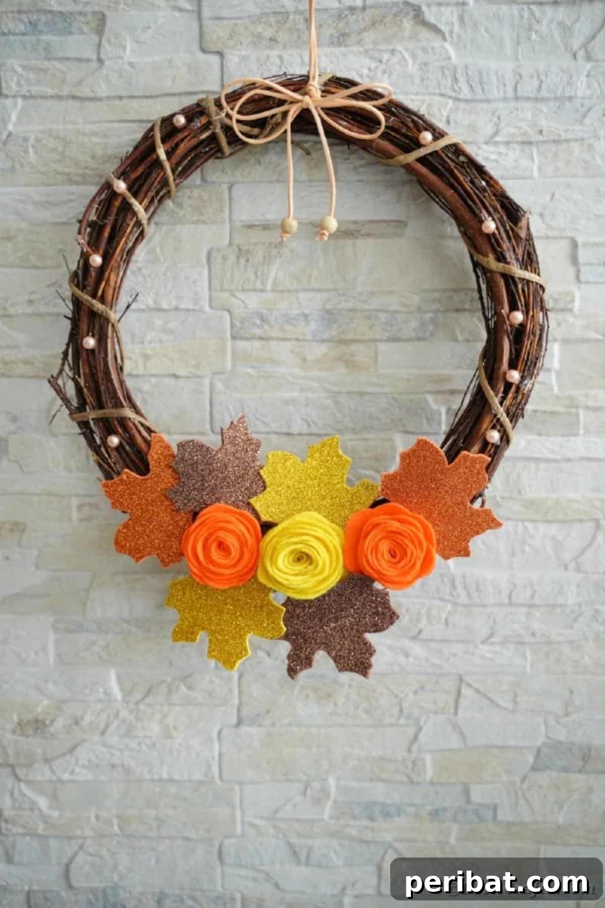 Autumn Grapevine Wreath with Soft Fabric Blooms 24 Grapevine wreath against brick wall