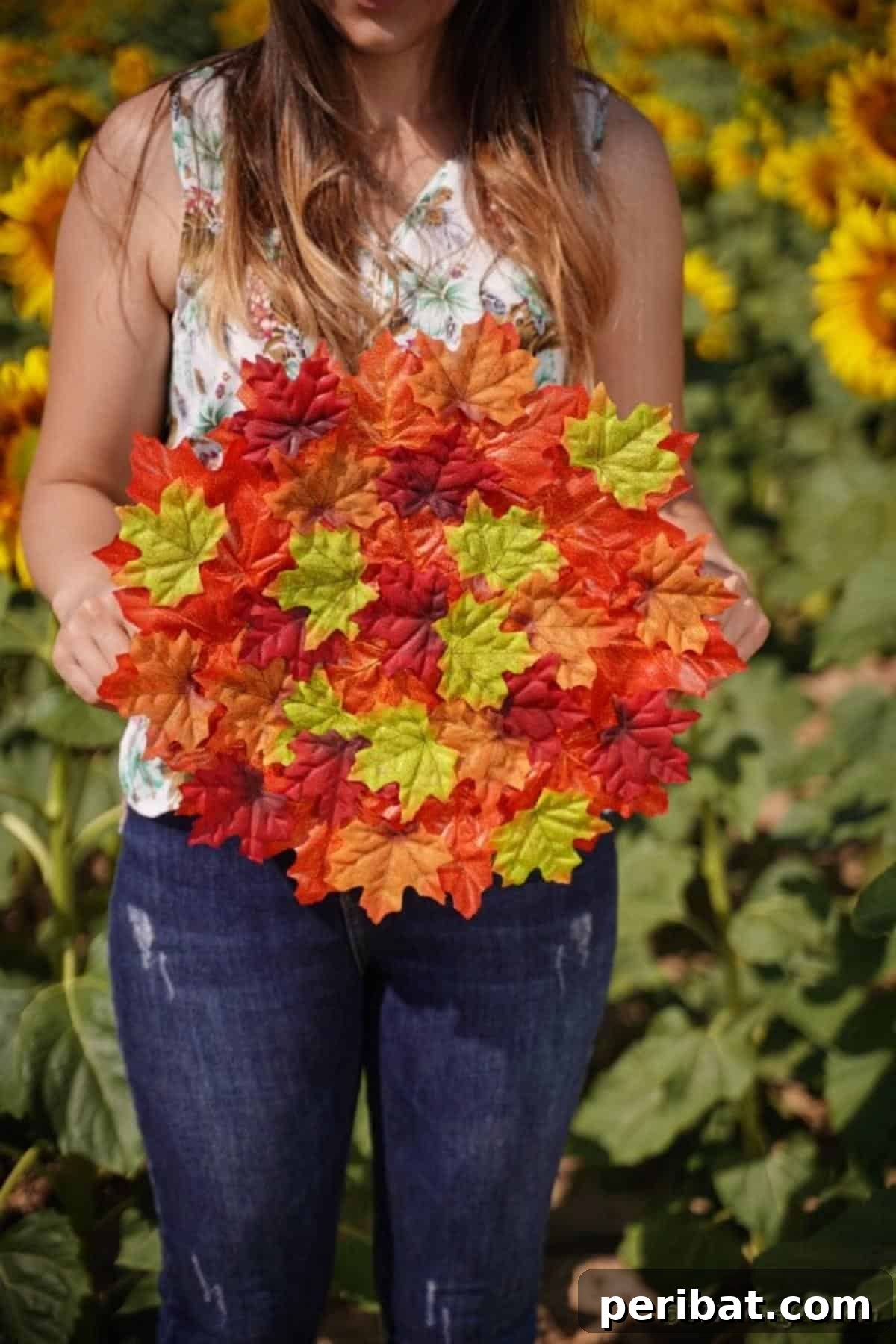 A person proudly holding the large, completed fall leaf placemat, showcasing its craftsmanship