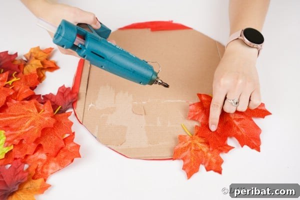 Gluing leaves onto cardboard