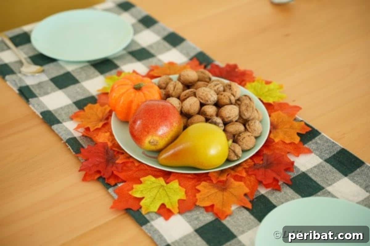Handmade fall leaf placemat on a rustic checked table runner, ready for autumn dining