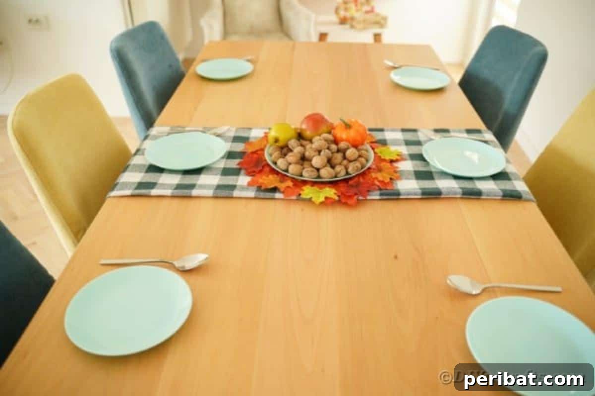 Rustic upcycled cardboard fall leaf placemat placed on a stylish checked table runner