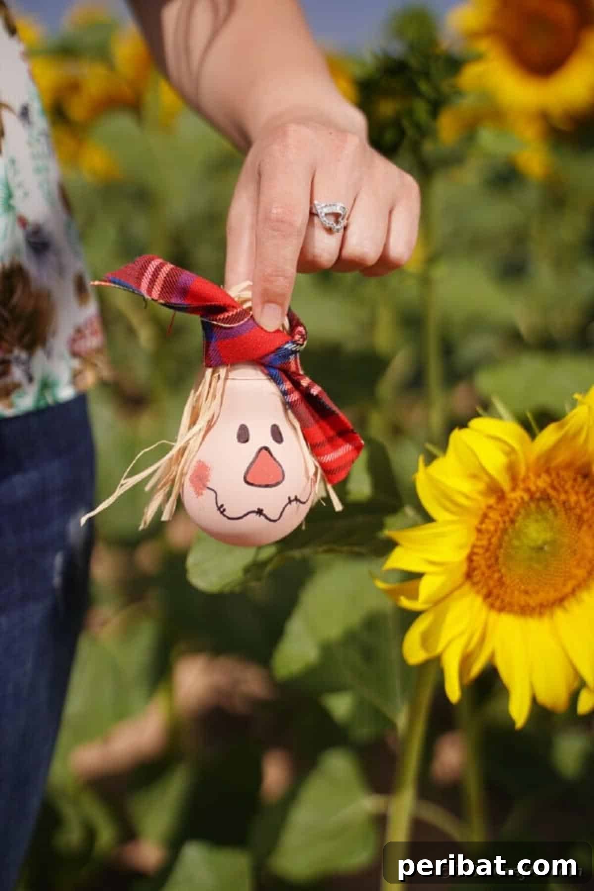 Charming Bulb Scarecrow Art from Recycled Lights 21 Woman holding a lightbulb scarecrow