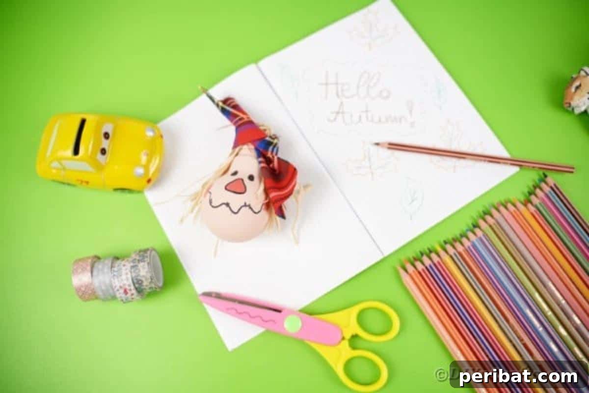 Charming Bulb Scarecrow Art from Recycled Lights 6 Scarecrow ornament on notebook by pencils