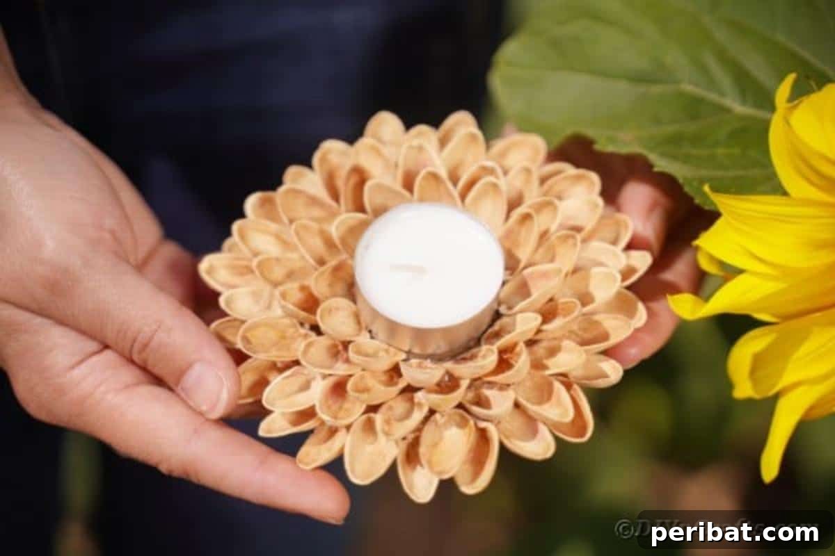 Artisanal Pistachio Shell Candle Holder 4 Close-up of a woman's hands holding a finished pistachio shell candle holder