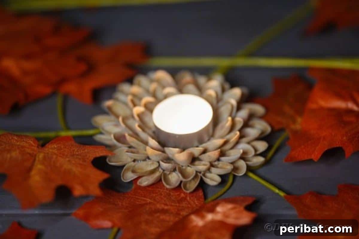 Artisanal Pistachio Shell Candle Holder 5 A charming pistachio shell candle holder casting a warm glow on a wooden surface