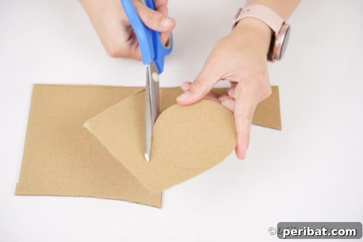 Artisanal Pistachio Shell Candle Holder 10 Scissors cutting a circular shape from cardboard