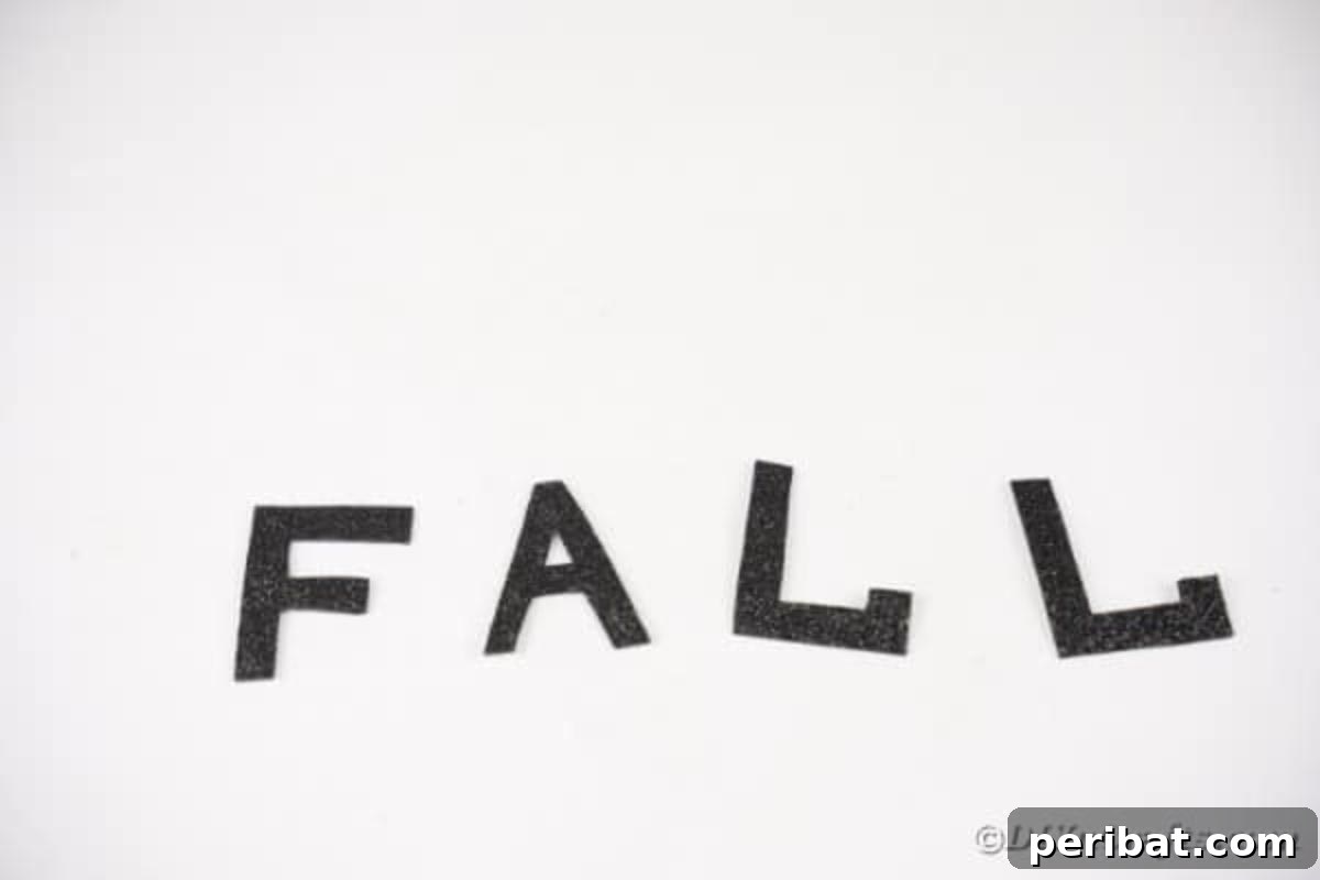 Cozy Farmhouse Fall Lettered Jars 13 The cut-out letters 'F', 'A', 'L', 'L' ready for assembly