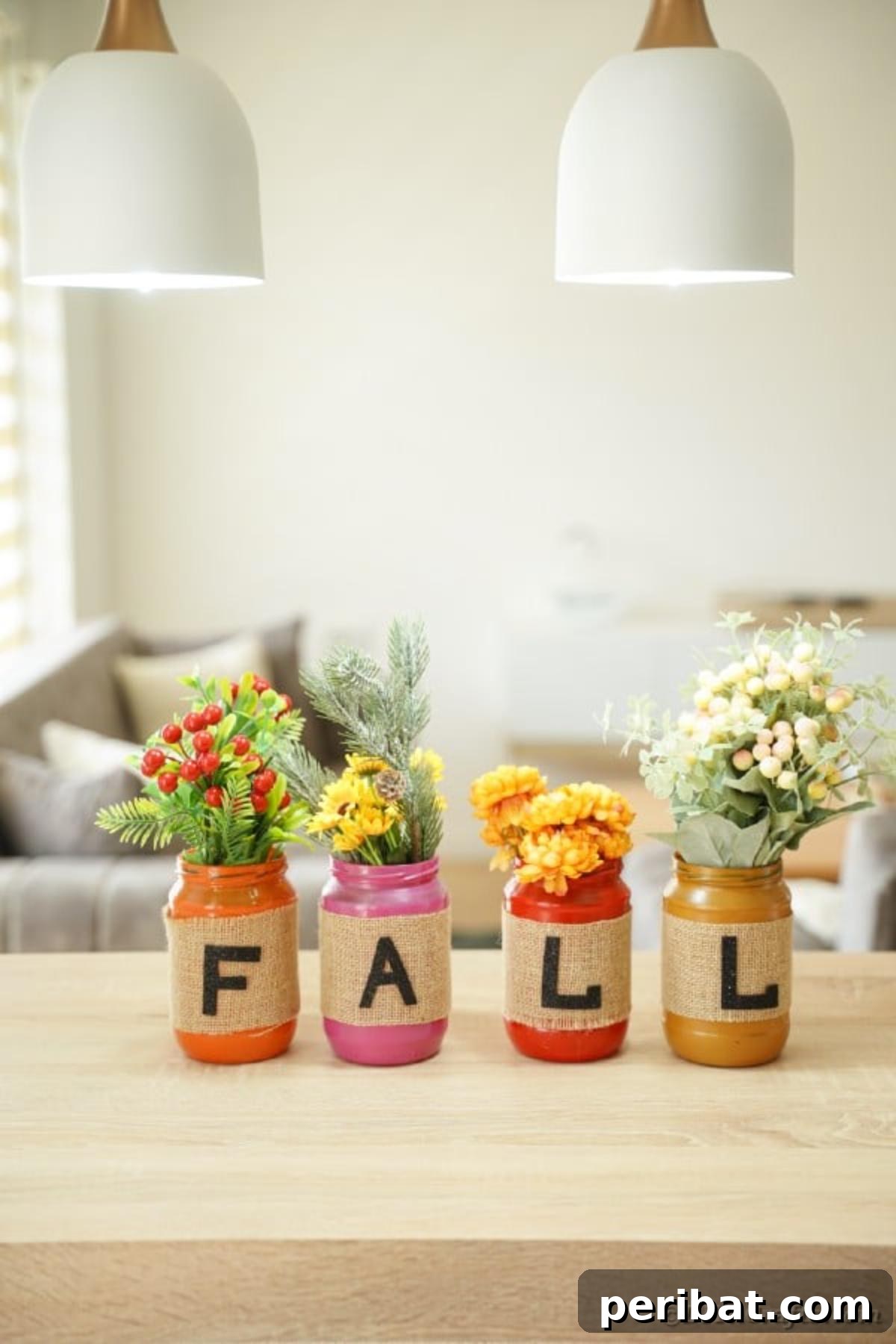 Cozy Farmhouse Fall Lettered Jars 16 Finished lettered fall mason jar decor spelling 'FALL' on a white table