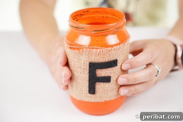 Cozy Farmhouse Fall Lettered Jars 21 Attaching burlap around jar