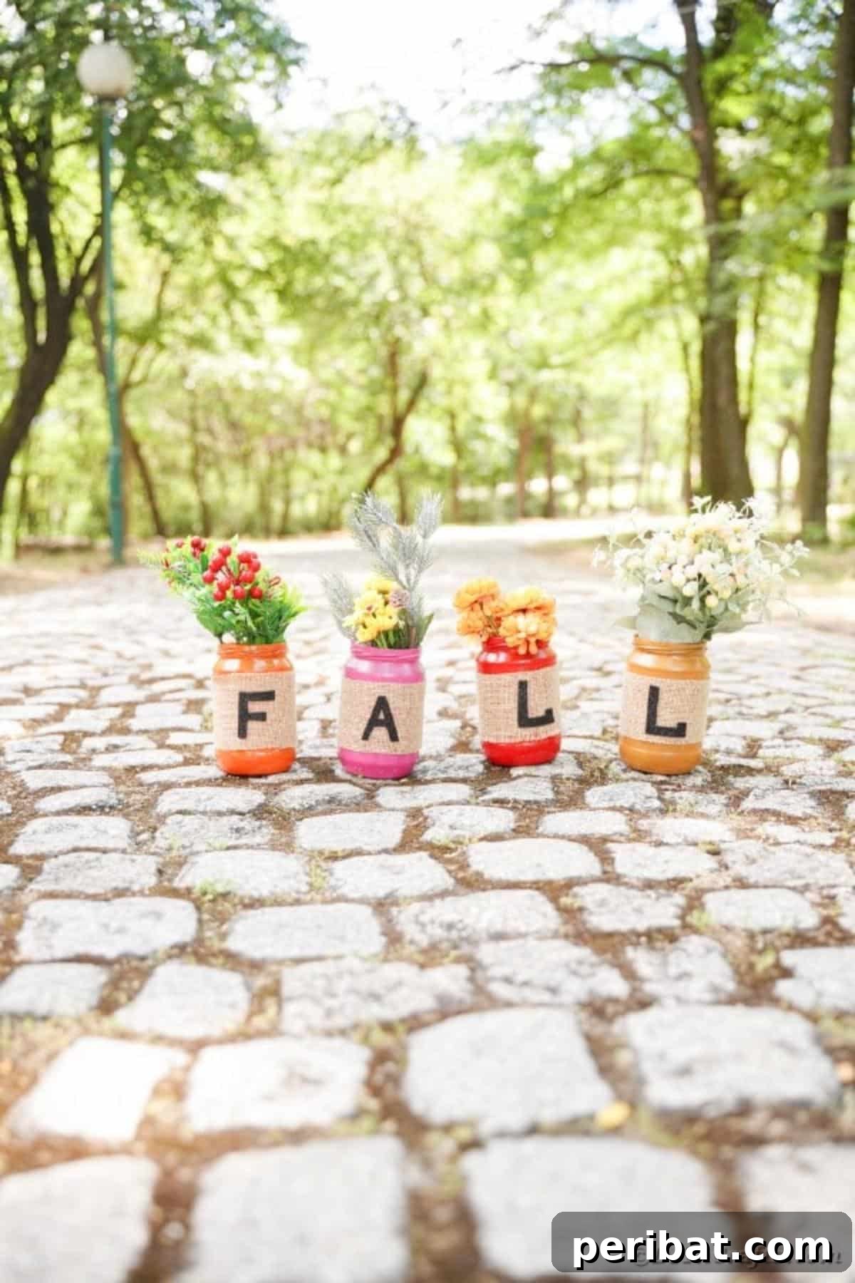 Cozy Farmhouse Fall Lettered Jars 25 Fall mason jar decor arranged on a rustic cobblestone outdoor setting