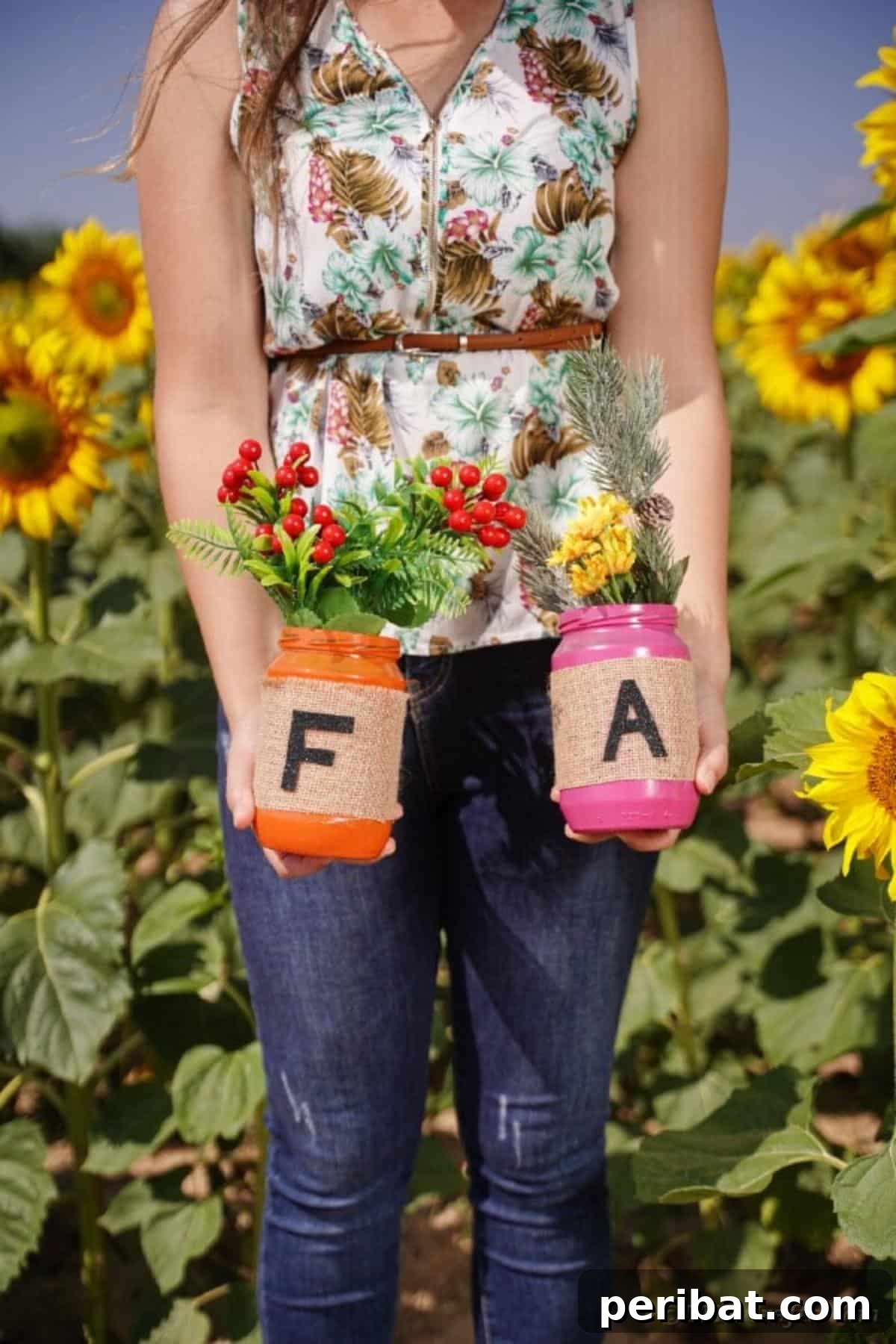 Cozy Farmhouse Fall Lettered Jars 26 Woman holding individual fall lettered mason jars, showcasing painted colors