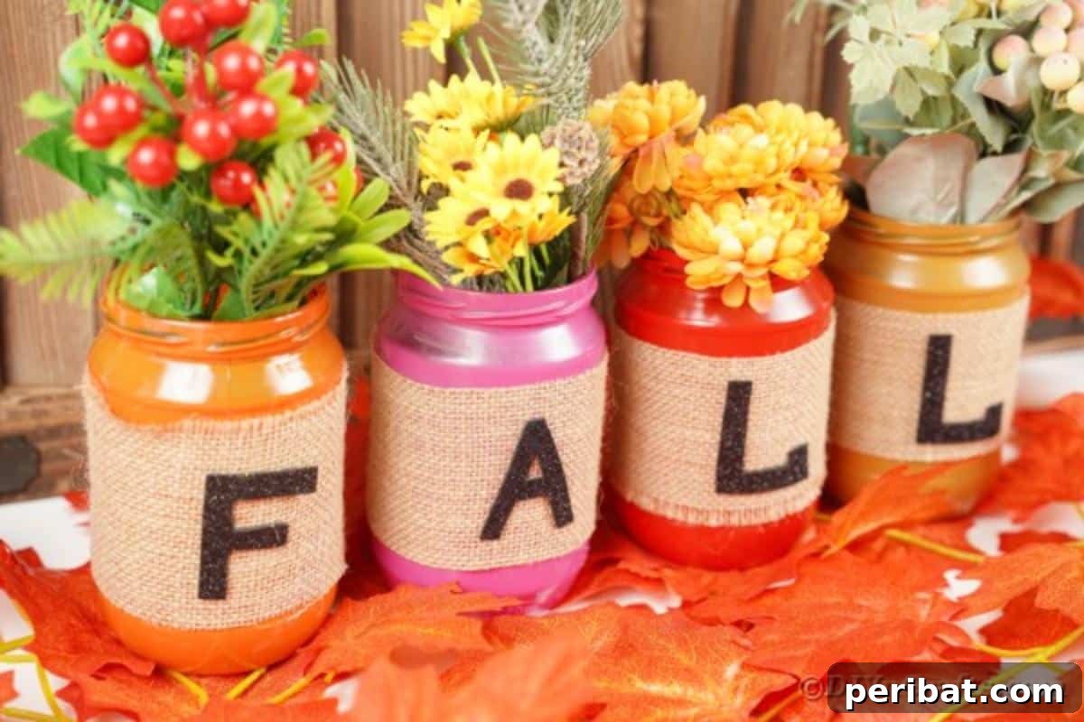 Cozy Farmhouse Fall Lettered Jars 5 Close-up of fall lettered mason jars amidst fake autumn leaves