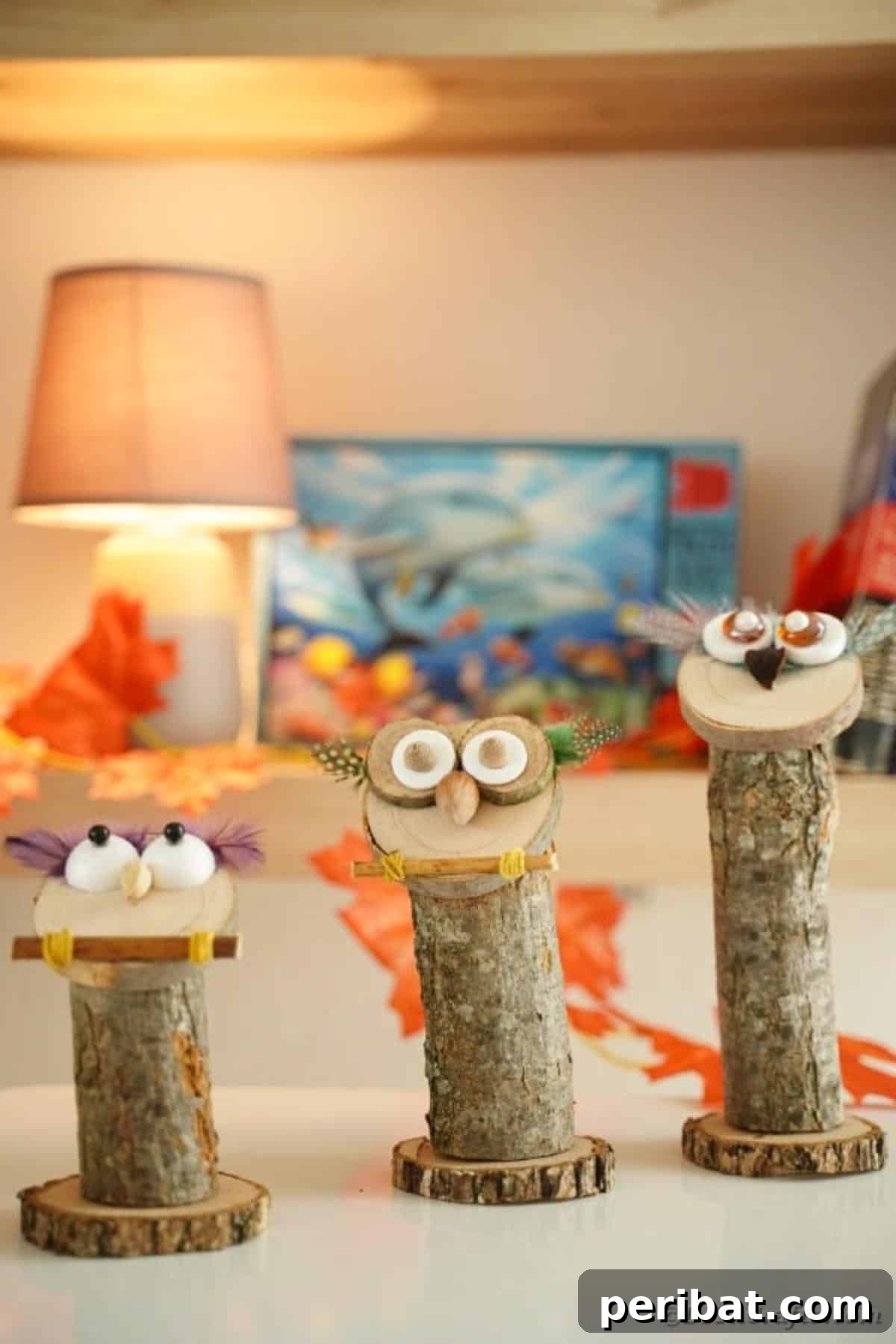 Whimsical Wooden Owls from Recycled Scraps Video Guide 20 A charming scene featuring three rustic wooden owls of varying heights, beautifully displayed on a wooden table, with one owl sporting a distinctive twig arm for added character.