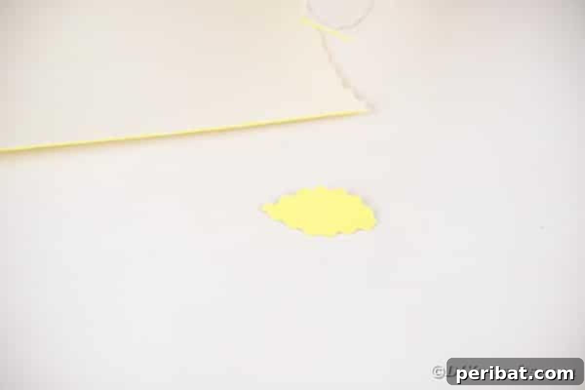 A neatly cut foam paper leaf, showcasing the decorative edge created by pinking shears.