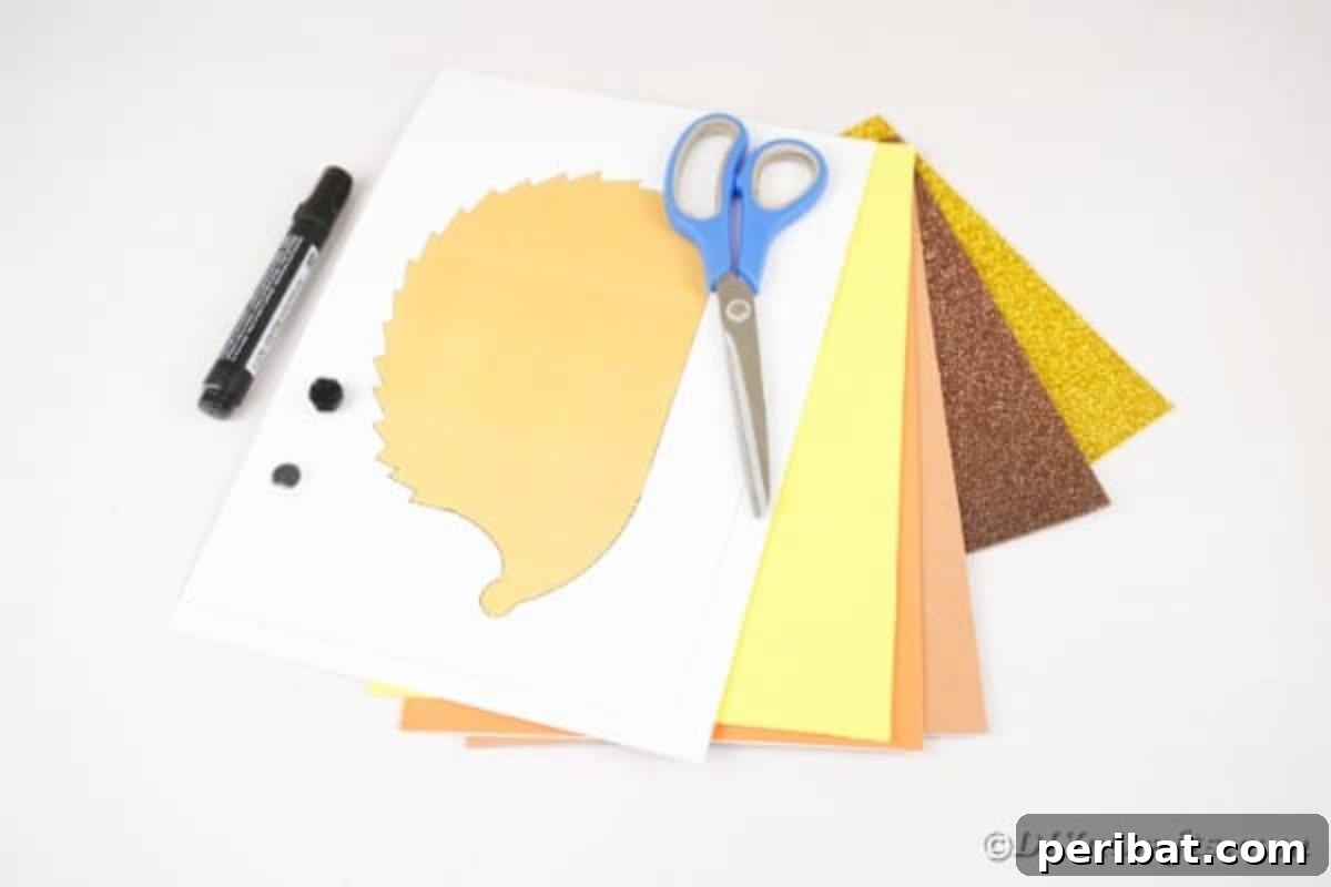 A vibrant selection of foam paper sheets in various fall colors, along with pinking shears and other tools, ready for making the paper leaf hedgehog.