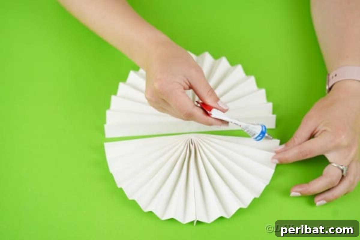 Fun and Easy Halloween Paper Fan Decor 12 Gluing paper