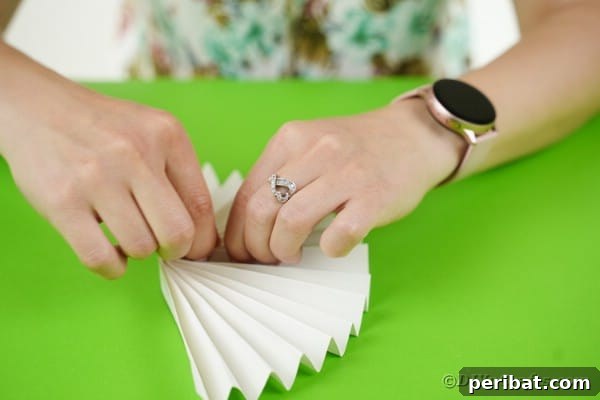 Fun and Easy Halloween Paper Fan Decor 31 Gluing paper