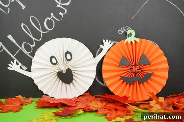 Halloween paper fan decorations by chalkboard