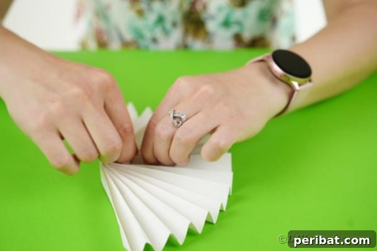 Fun and Easy Halloween Paper Fan Decor 10 Gluing paper