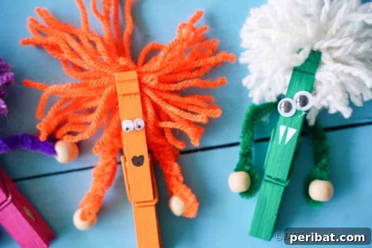 Spooktacular Clothespin Monster Craft 20 A close-up of several completed clothespin monsters on blue boards