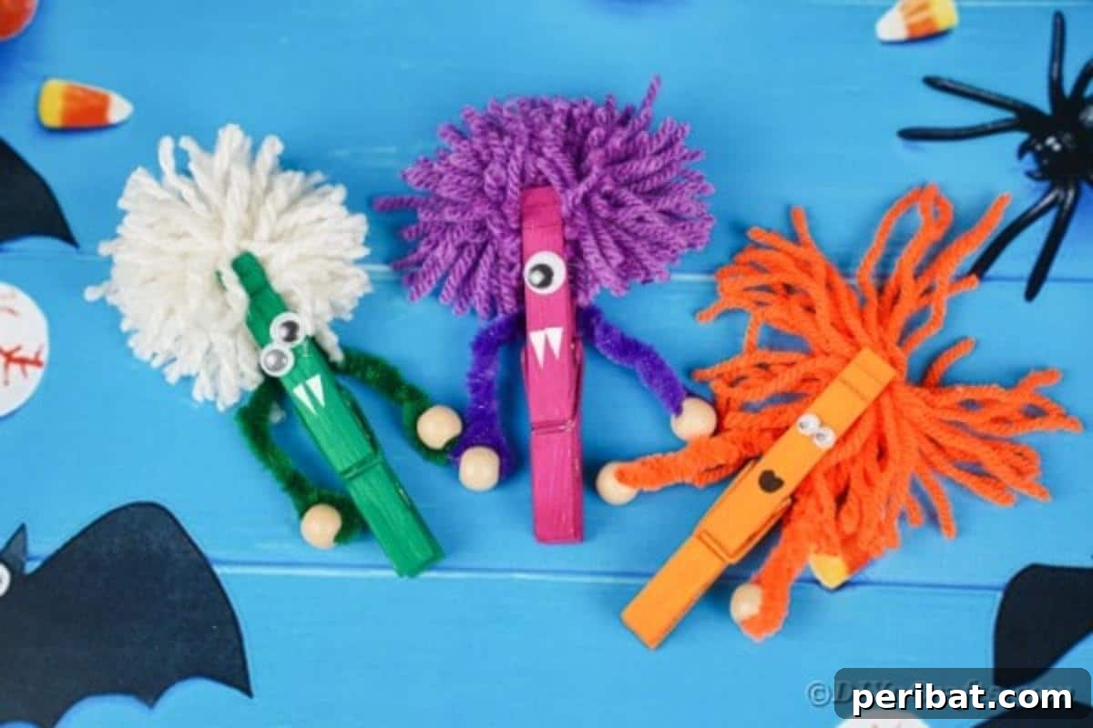 Spooktacular Clothespin Monster Craft 4 Three colorful clothespin monsters with googly eyes and pipe cleaner arms