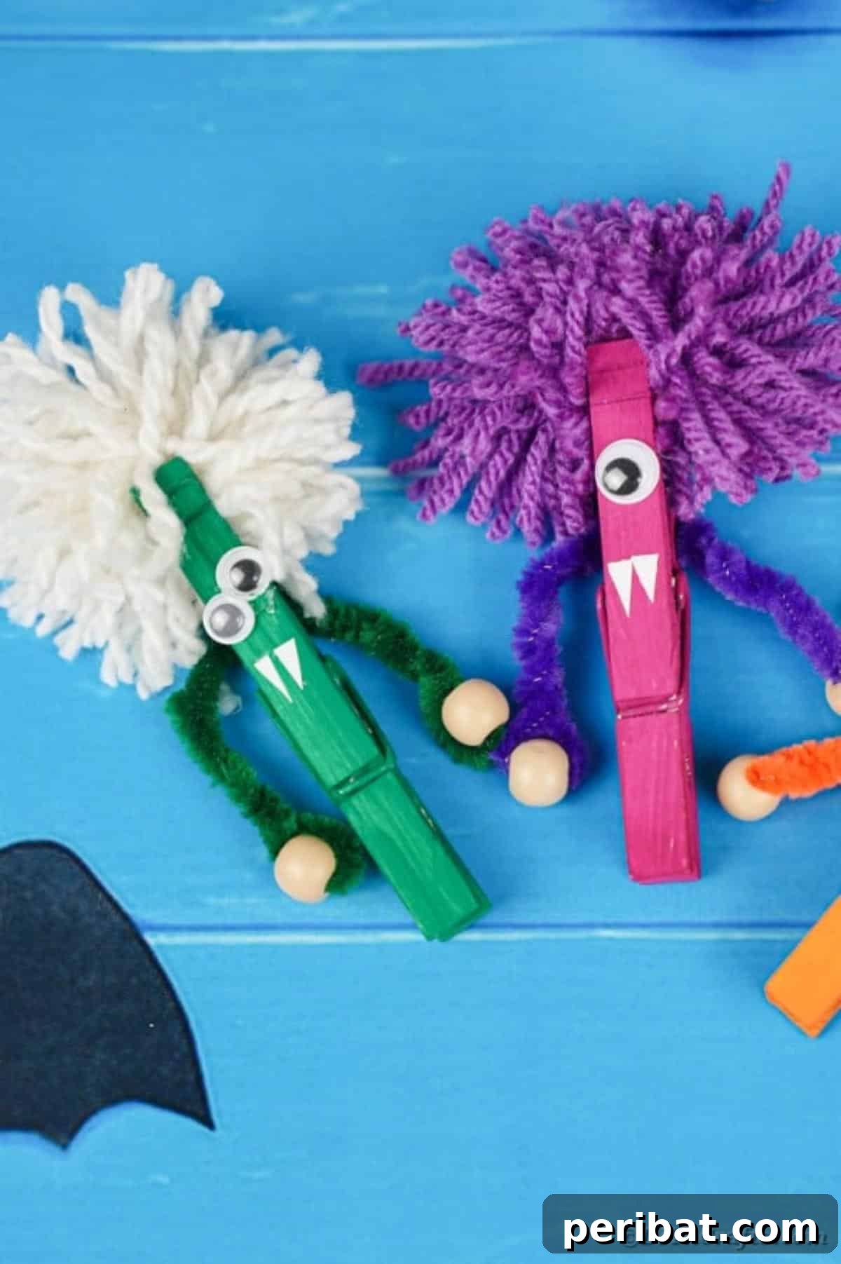 Spooktacular Clothespin Monster Craft 23 A delightful arrangement of colorful clothespin monsters on blue boards
