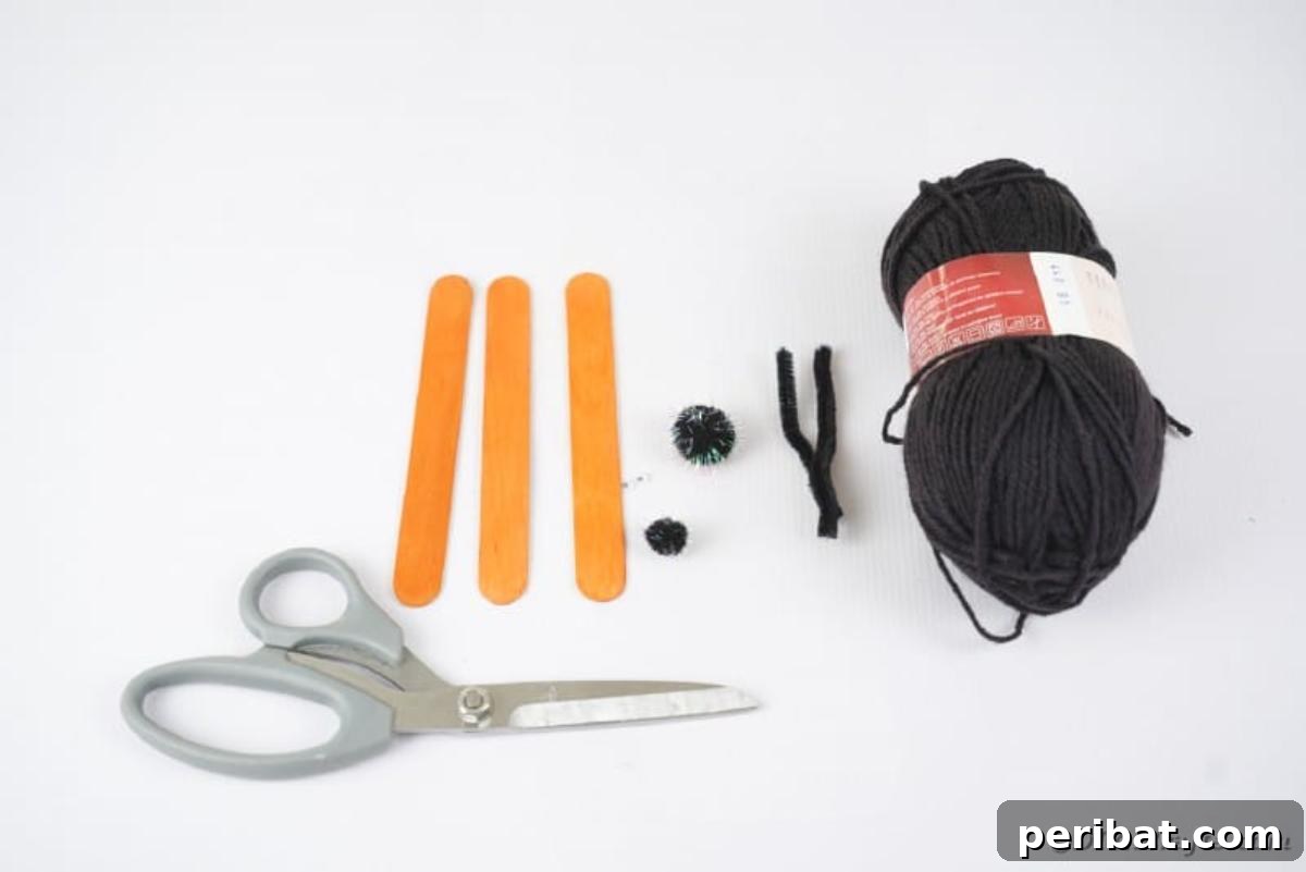 Spooky Stick Spiderwebs 8 A collection of craft supplies including craft sticks, paint, yarn, pom-poms, googly eyes, and pipe cleaners, ready for the project.