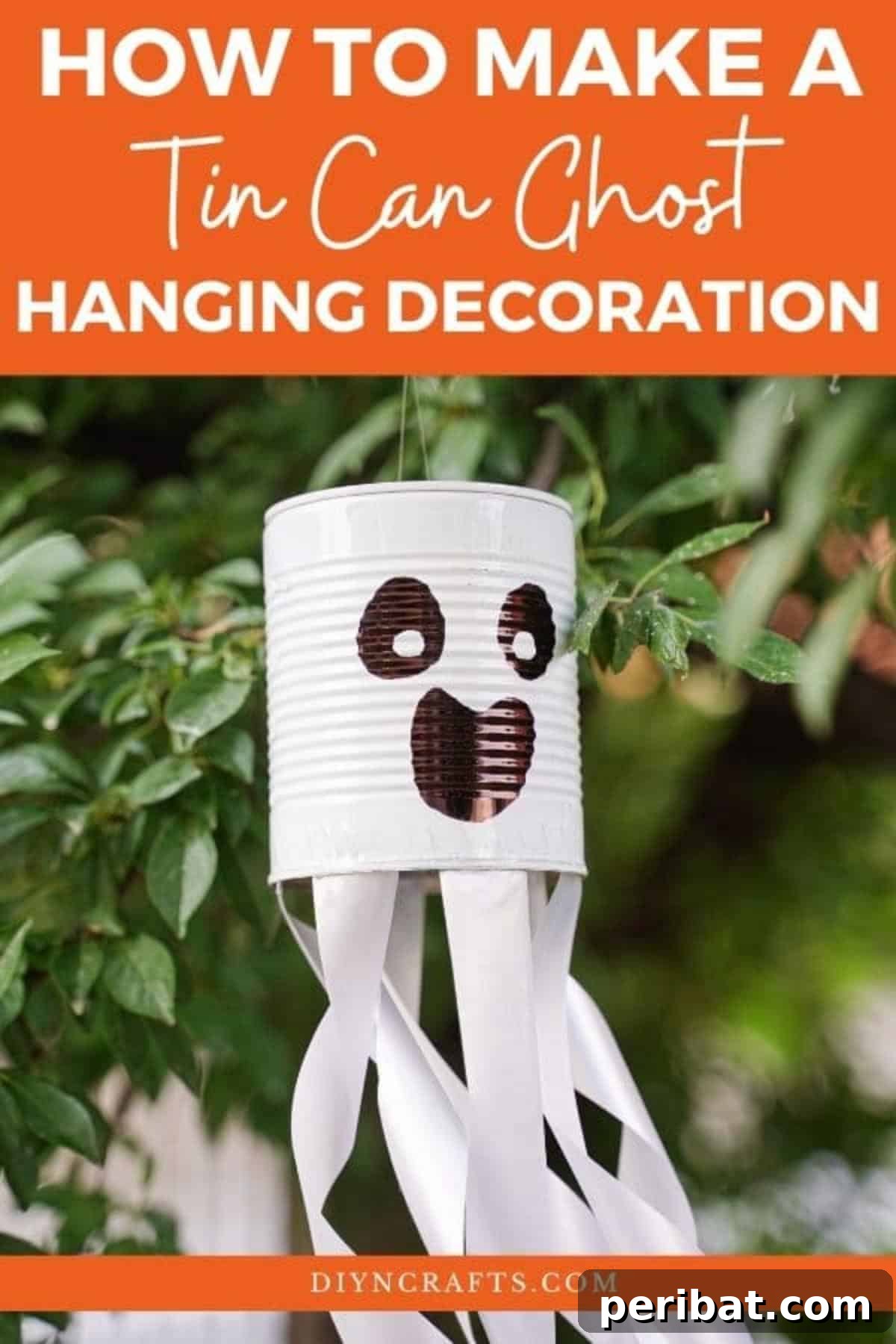 Haunting Tin Can Ghost Ornament 2 A charming DIY tin can ghost hanging from a tree branch, showcasing its simple yet effective design for Halloween decor.