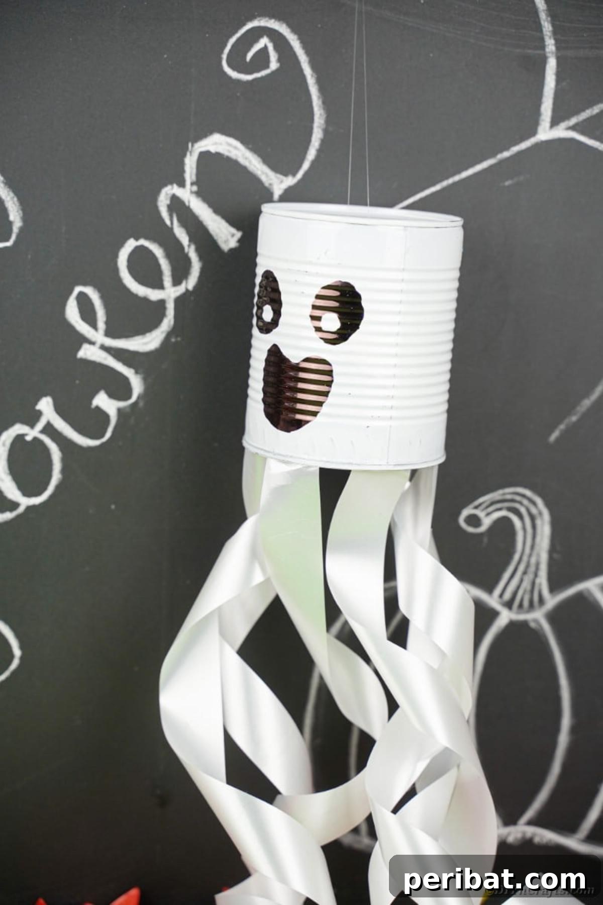 Haunting Tin Can Ghost Ornament 18 A tin can ghost decoration positioned artfully beside a chalkboard wall featuring Halloween-themed writing, illustrating its potential for creative display pairings.