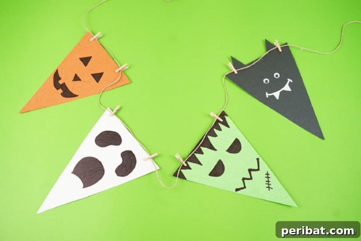 Completed Halloween garland laid flat on a green surface, showcasing the different characters