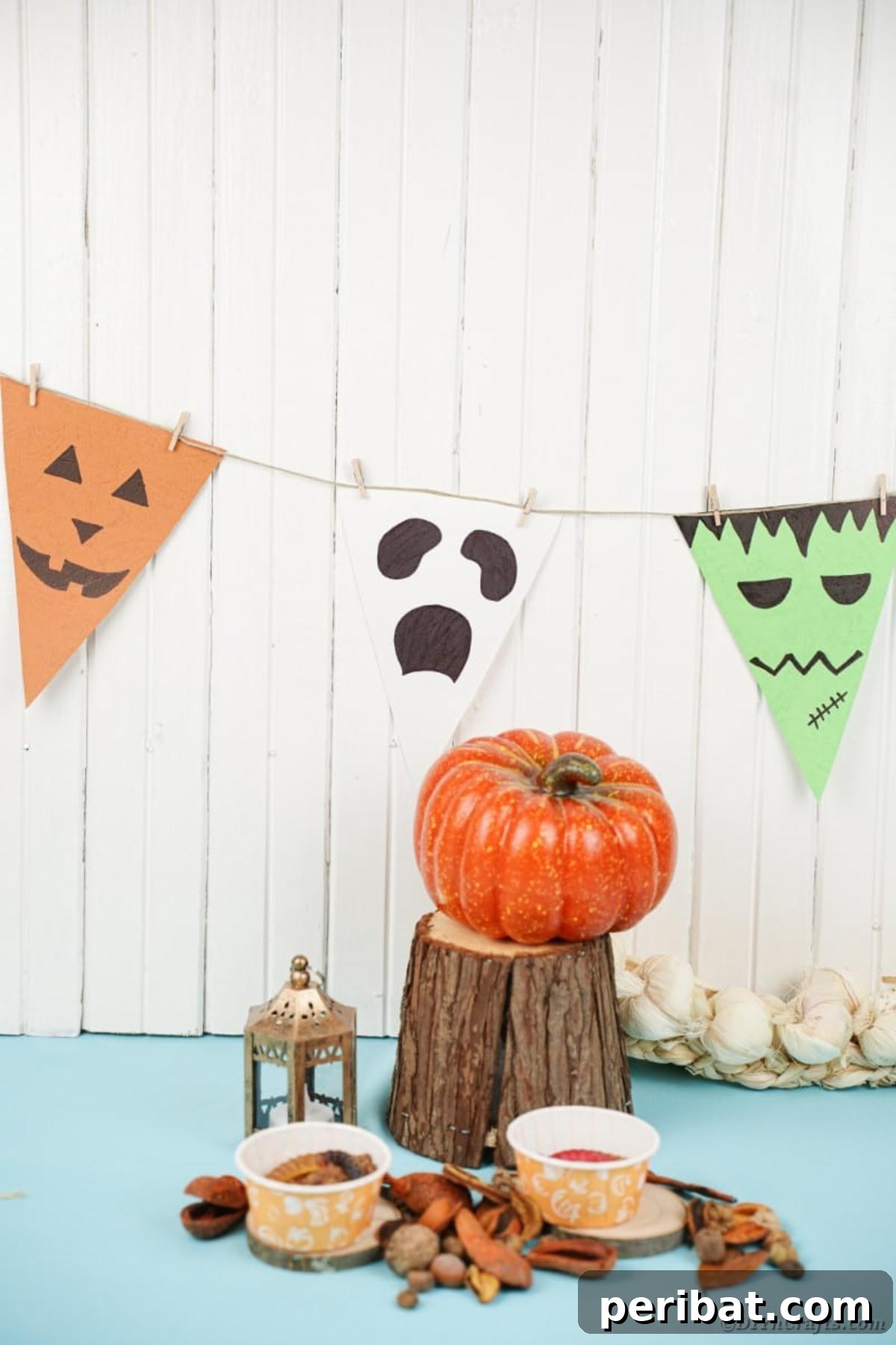Close-up of the Halloween garland on a white background with other small decor items