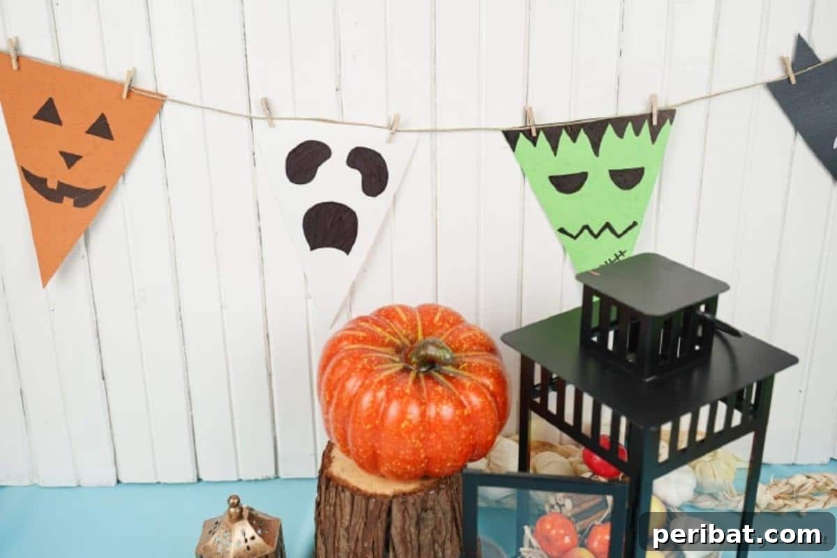 Halloween garland on a white background with other Halloween decor elements