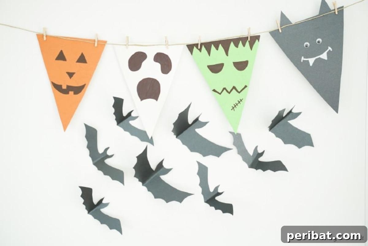 Halloween bunting hanging near a flying bat decoration