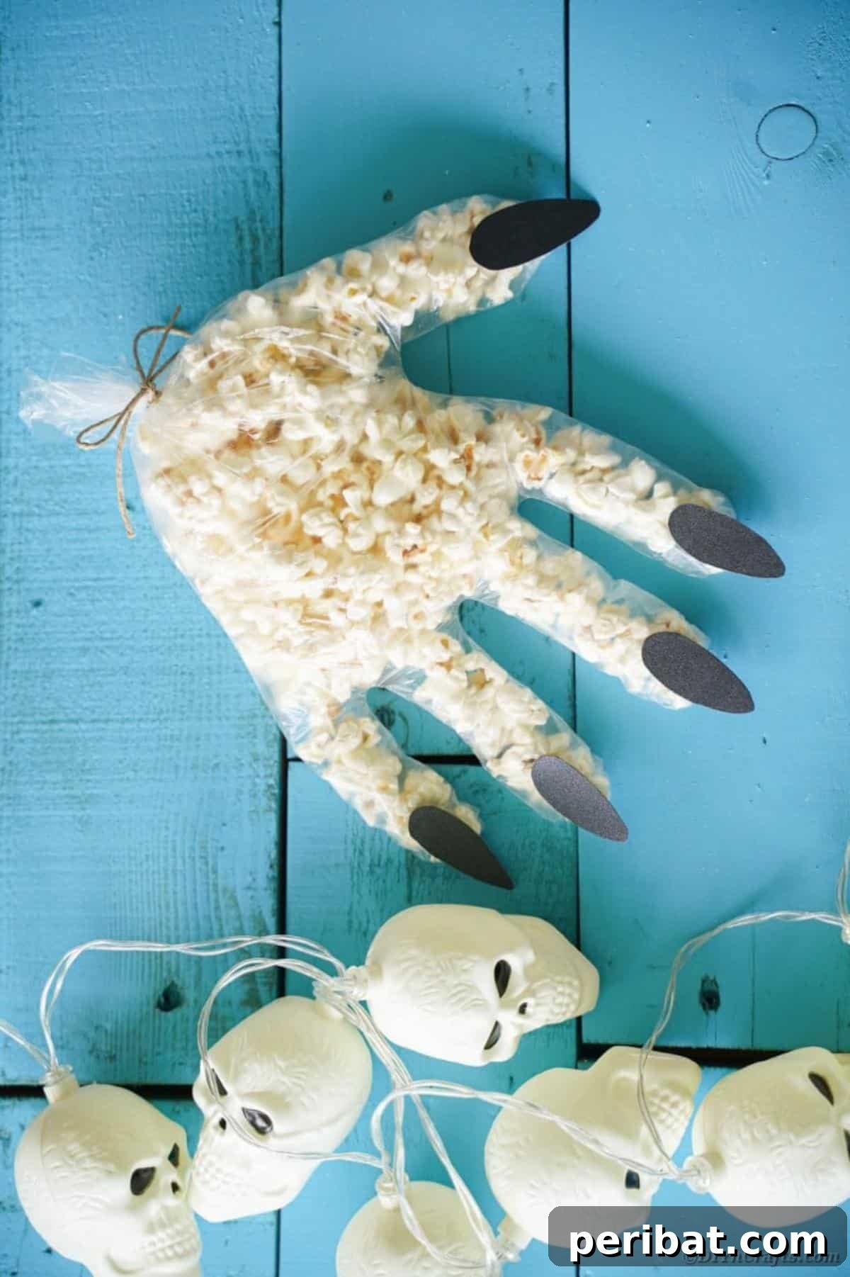 Creepy Popcorn Hand Snacks 18 Popcorn hands on blue wood surface
