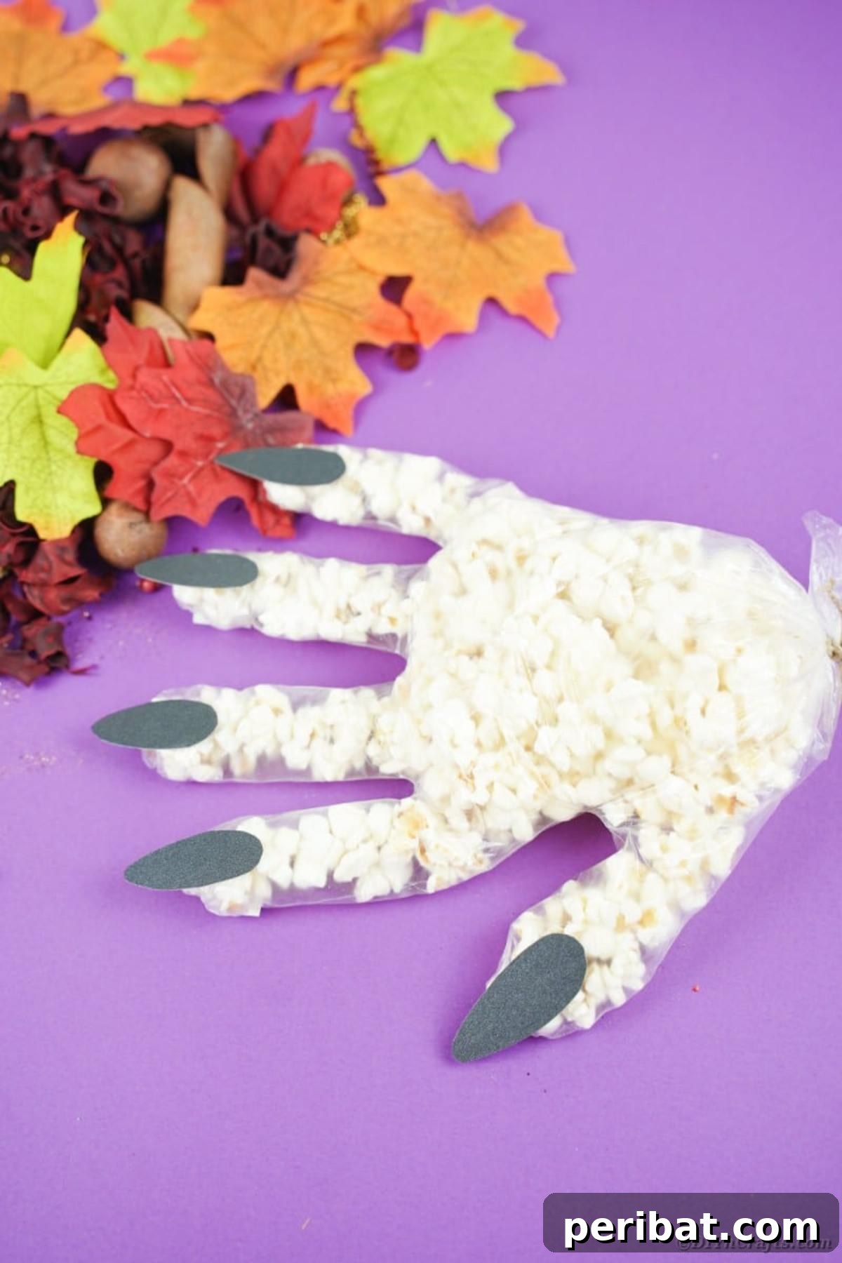 Creepy Popcorn Hand Snacks 21 Popcorn hand on purple surface