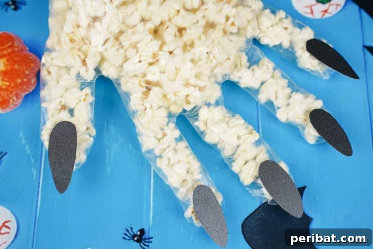 Creepy Popcorn Hand Snacks 6 Popcorn hand on blue surface
