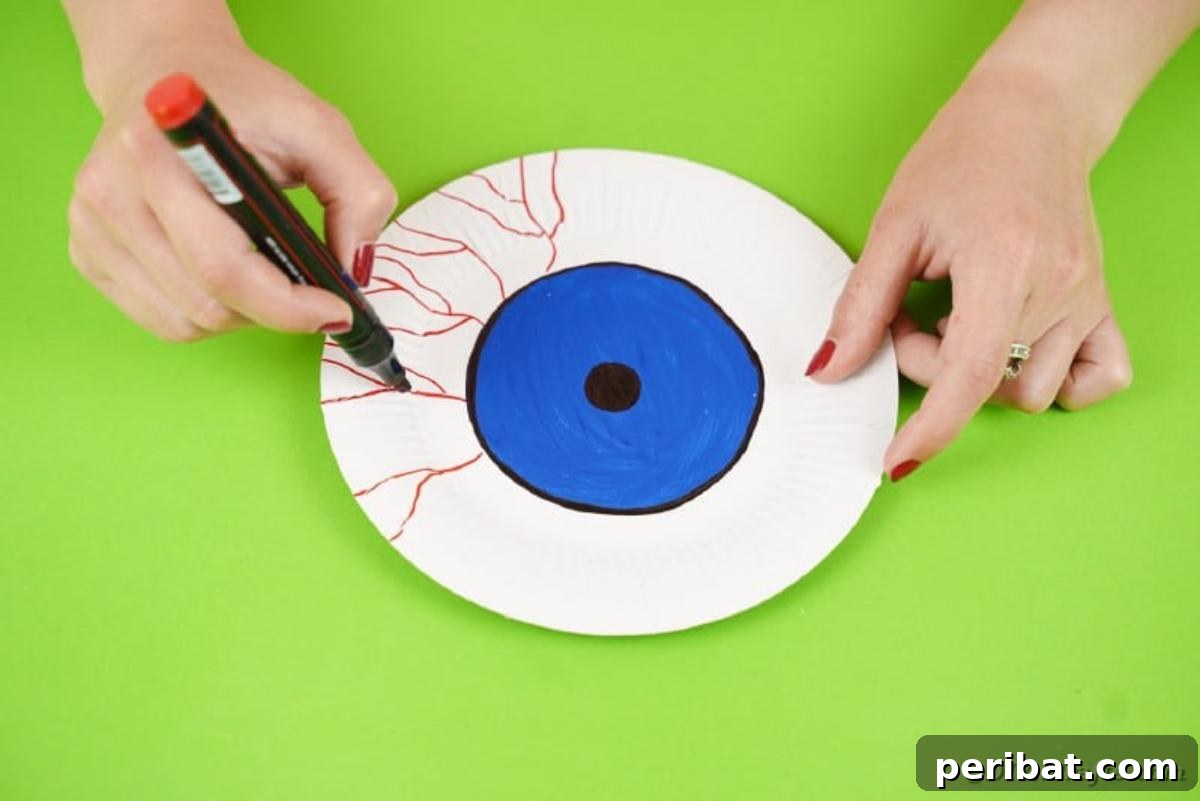 Staring Eyeball Halloween Plate Art 11 Drawing red veins on eyeball