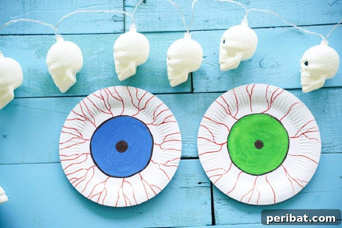 Staring Eyeball Halloween Plate Art 5 Paper plate eyes on blue boards